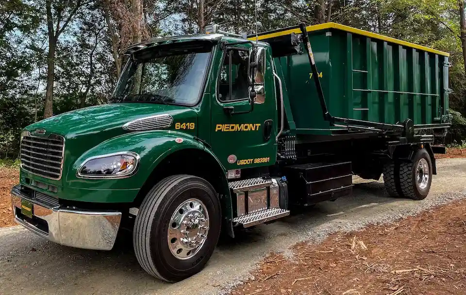 greensboro dumpster rental service delivering a roll-off dumpster bin